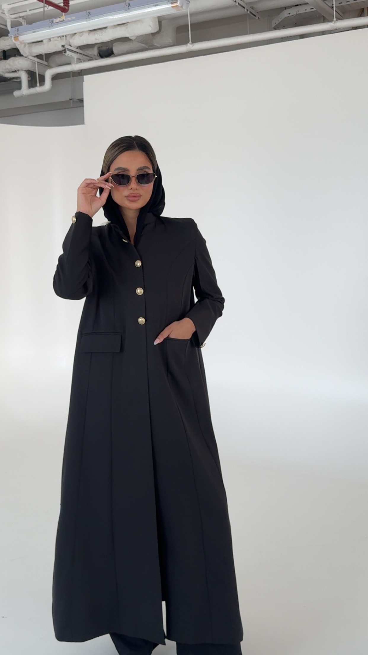 Black blazer with shoulders and gold buttons